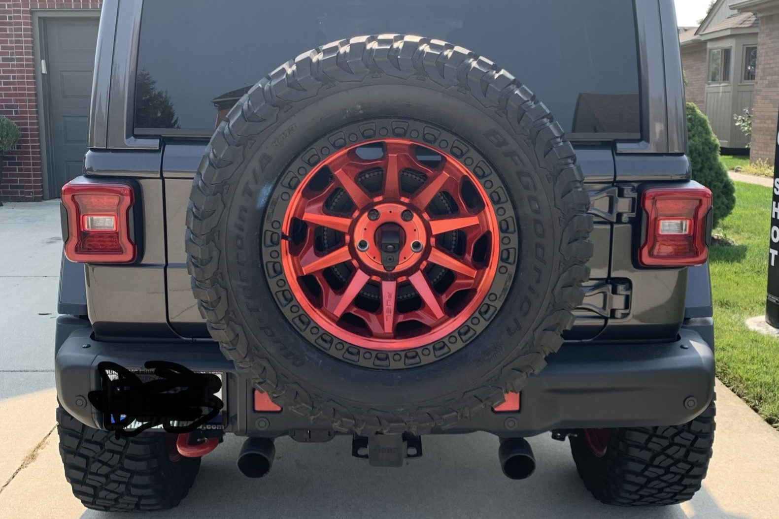 Rear of the Jeep Rubicon with a red wheel and BFGoodrich tire as the spare