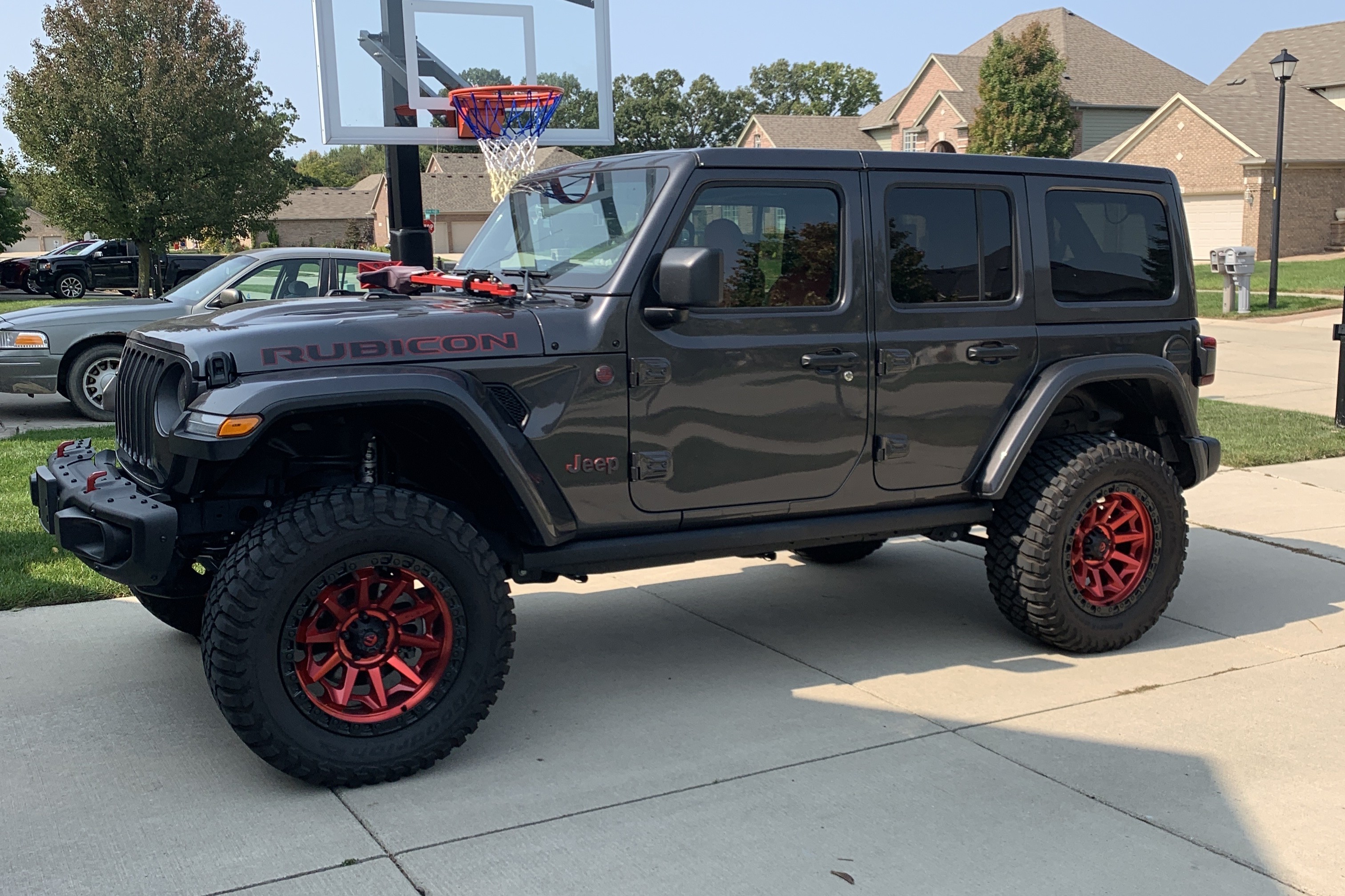 Lifted 2020 Jeep Rubicon with red wheels
